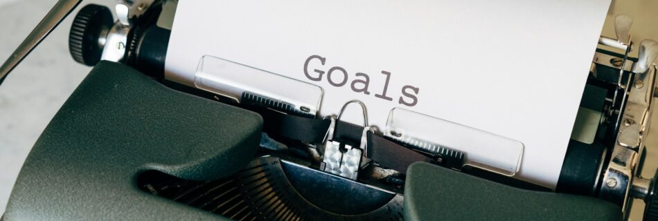 black and white typewriter on green textile