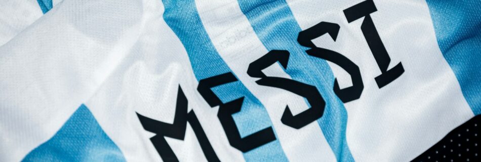 a close up of a soccer jersey with the word messi on it